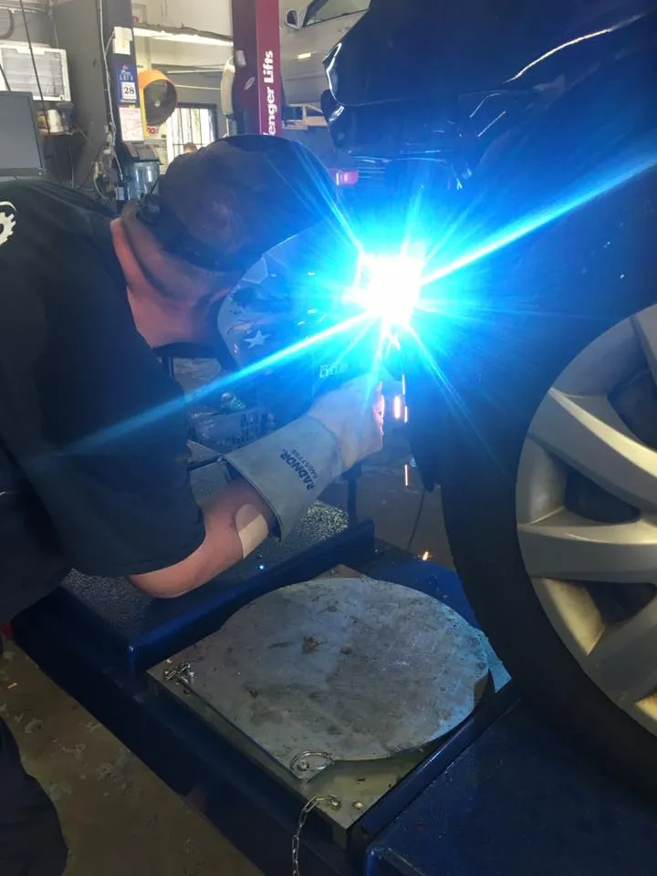 Brandee welding in the shop